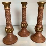 Trio of large brown and gold candlesticks
