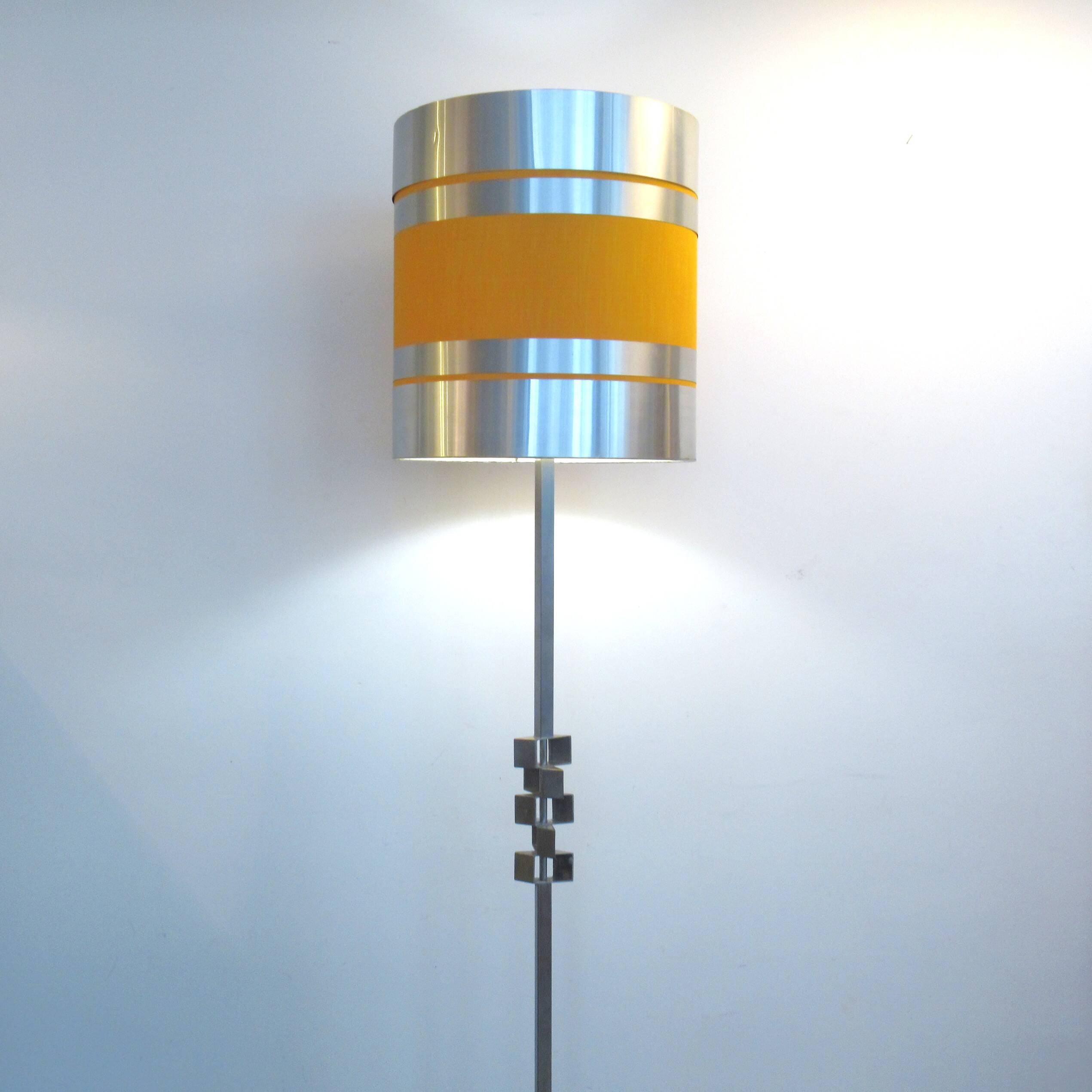 Floor lamp with a large orange shade and metal from the 1960s.
