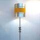Floor lamp with a large orange shade and metal from the 1960s.