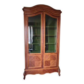 Glass bookcase with gendarme hat