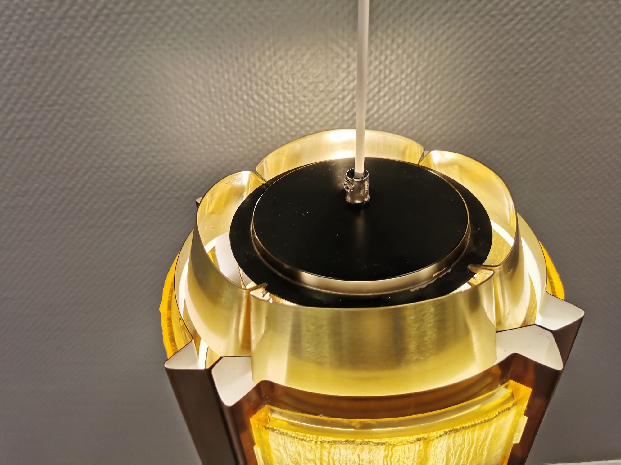Danish hanging lamp, made in brass colored and brown metal, with yellowish hard pressed plastic deta