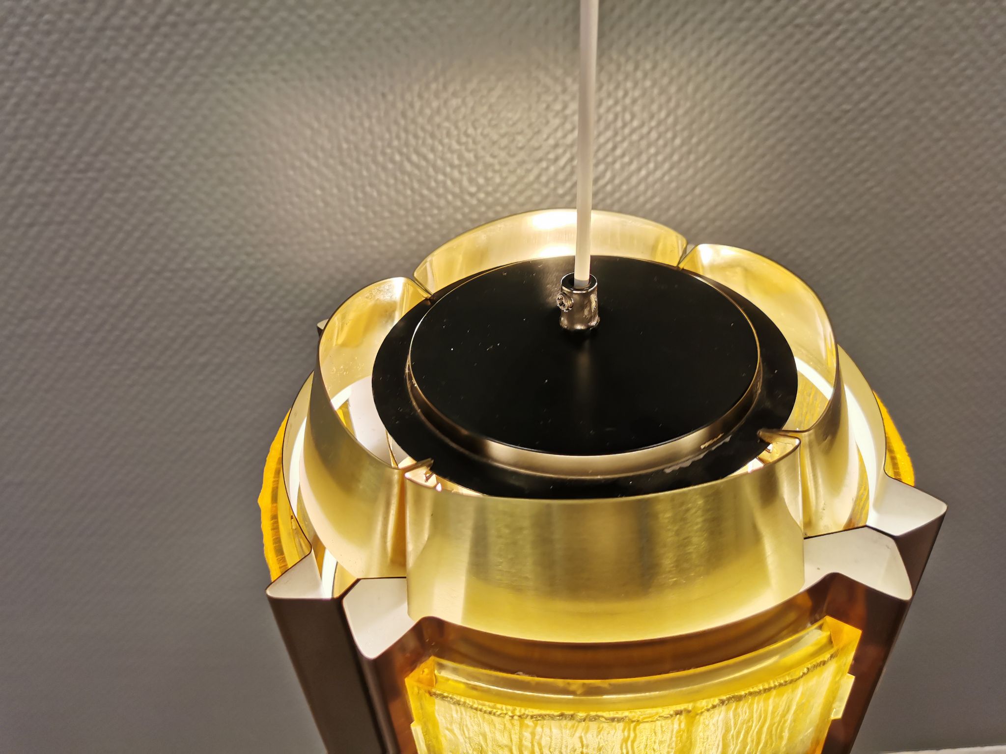 Danish hanging lamp, made in brass colored and brown metal, with yellowish hard pressed plastic deta