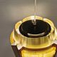 Danish hanging lamp, made in brass colored and brown metal, with yellowish hard pressed plastic deta
