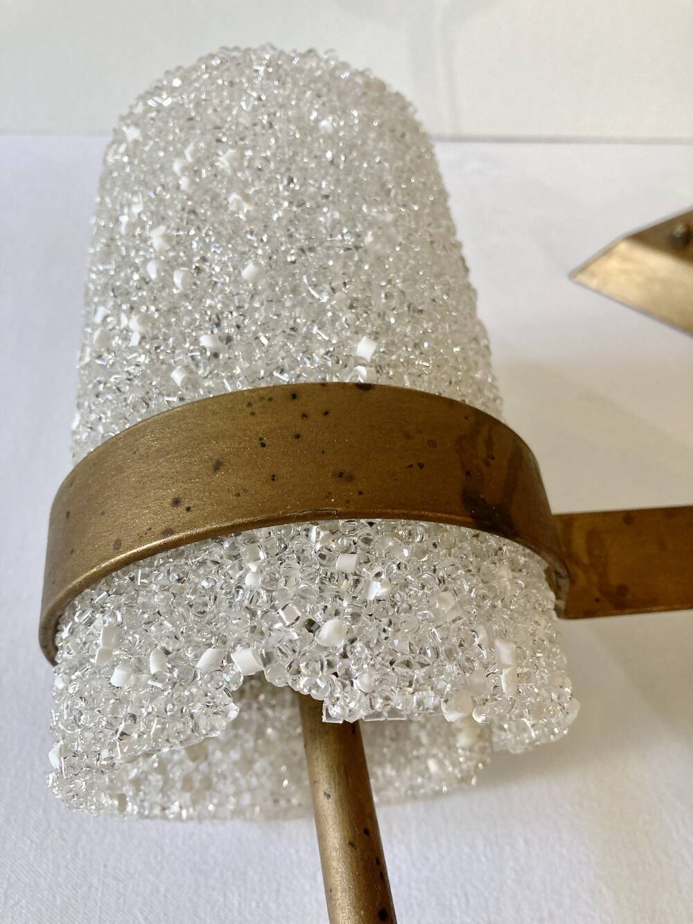 Set of three wall sconces in gold metal and ice effect Perspex, 1960-70.
