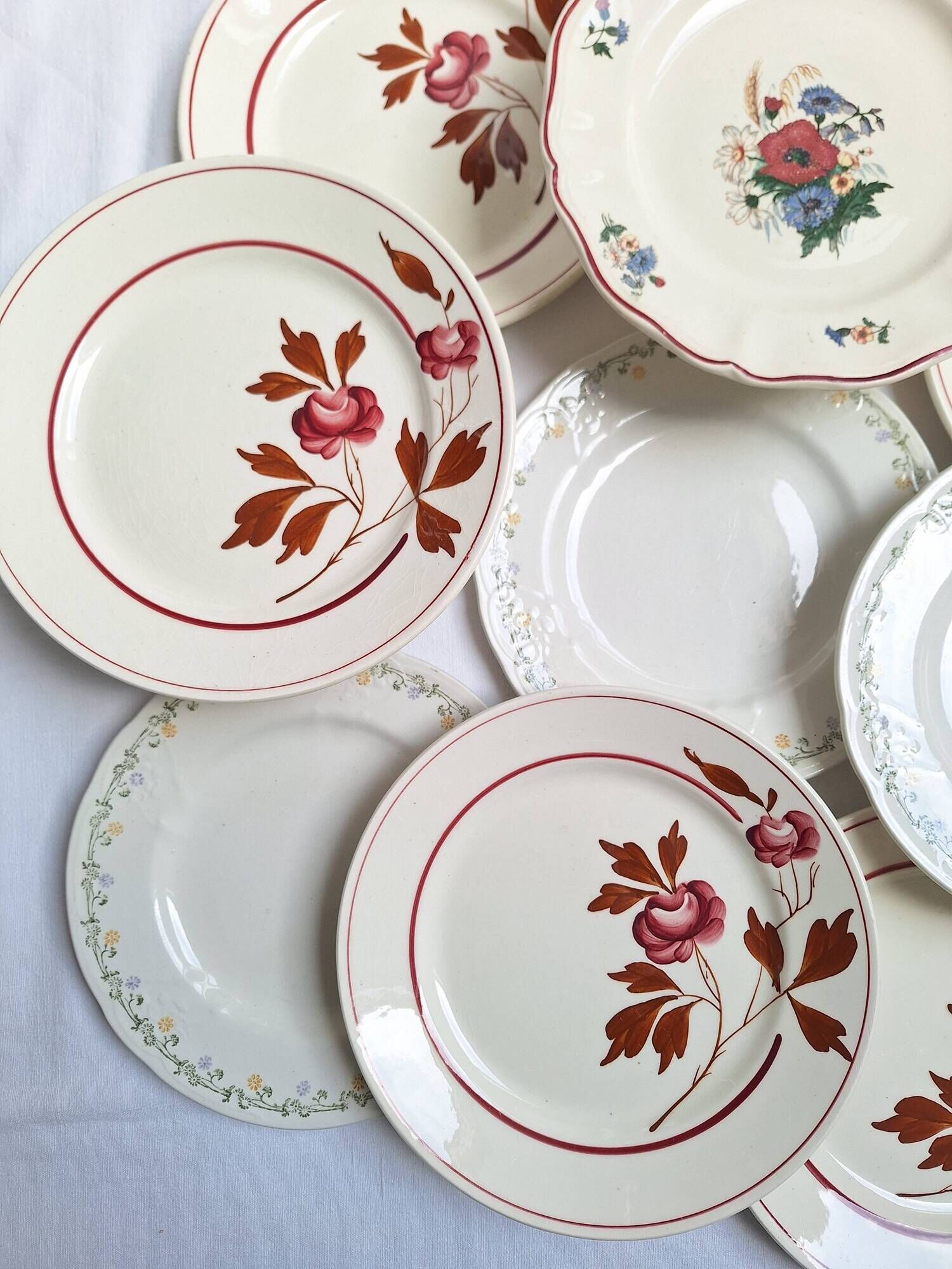 Vintage flower dessert plates from Sarreguemines, Longwy, and Lunéville.