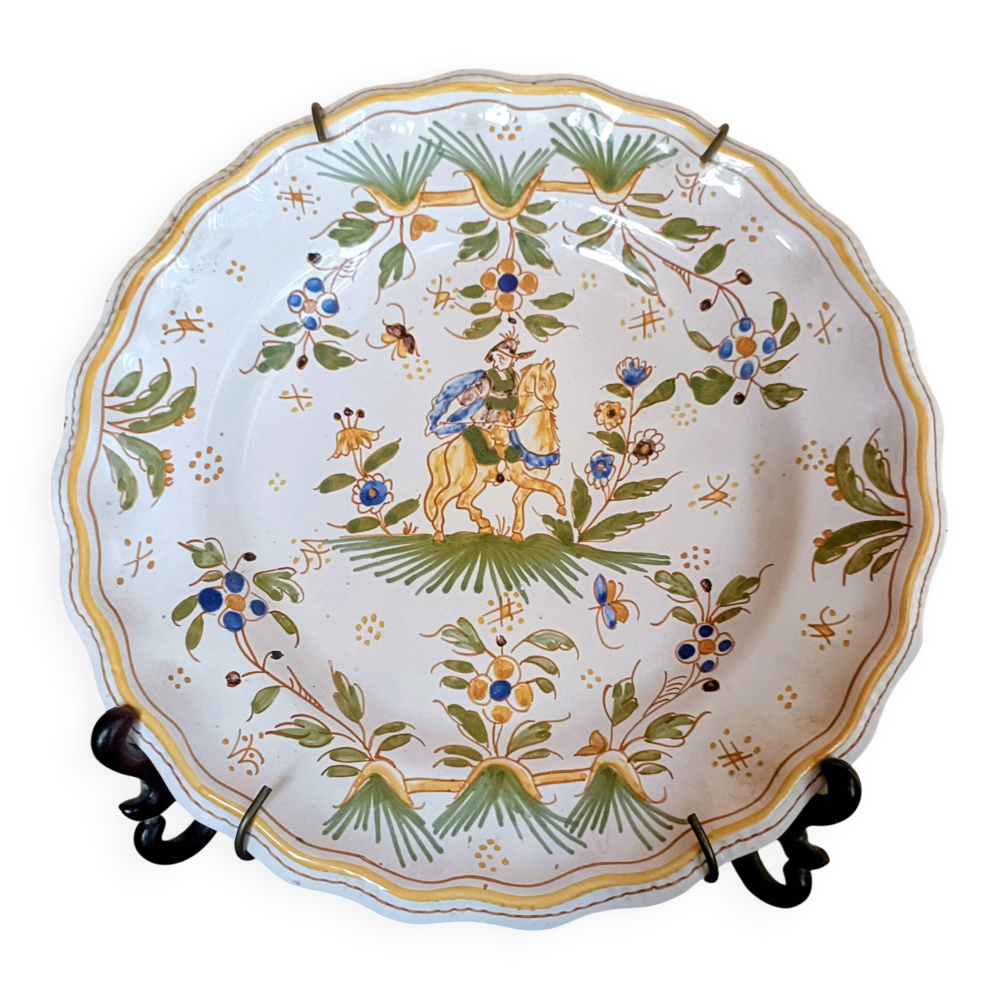 Antique Moustiers plate hand-decorated with a horseman.
