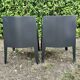 2 black Toy chairs designed by Starck