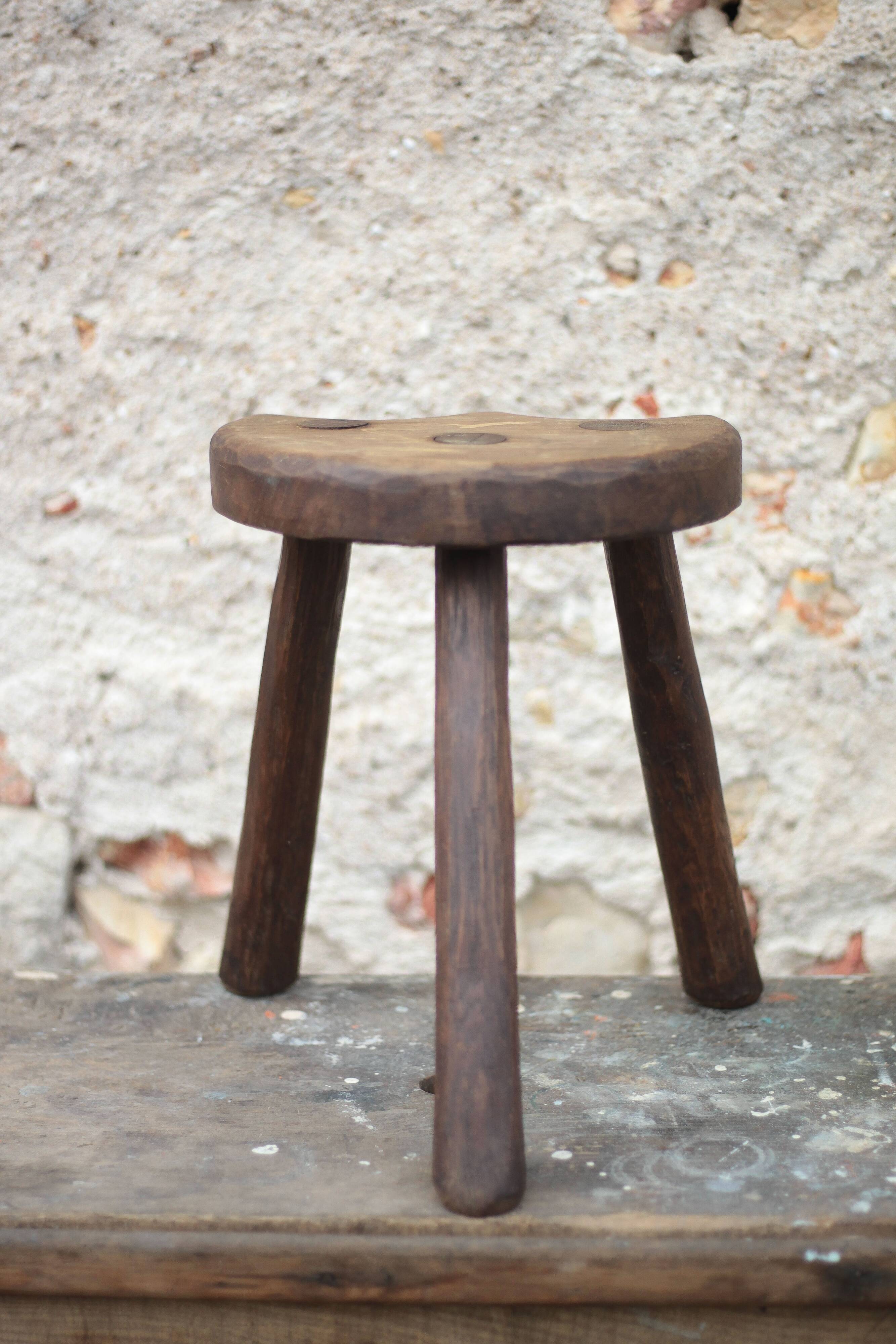 Vintage wooden tripod stool, mountain work, wabi-sabi, shepherd.