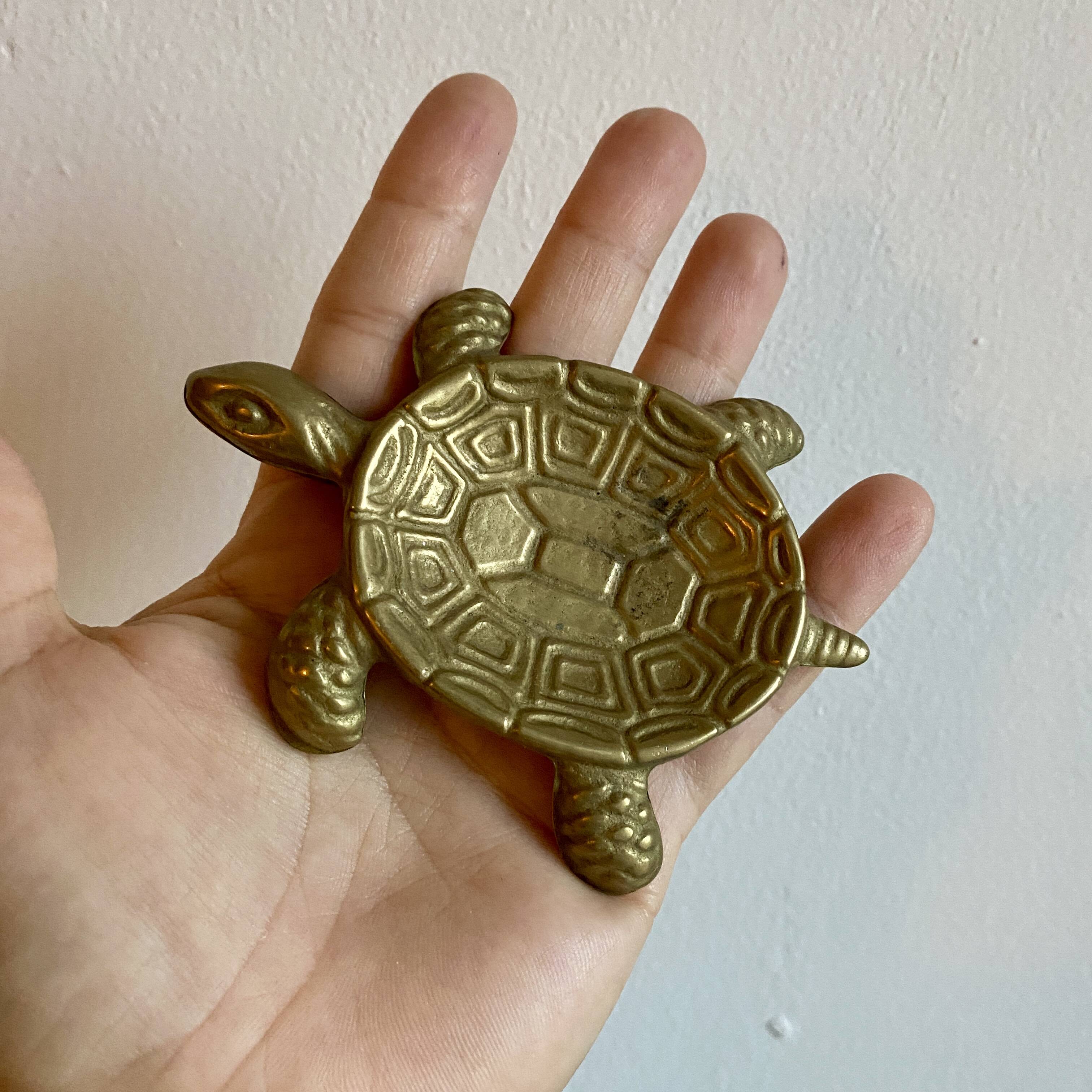 Vintage brass turtle pocket emptier