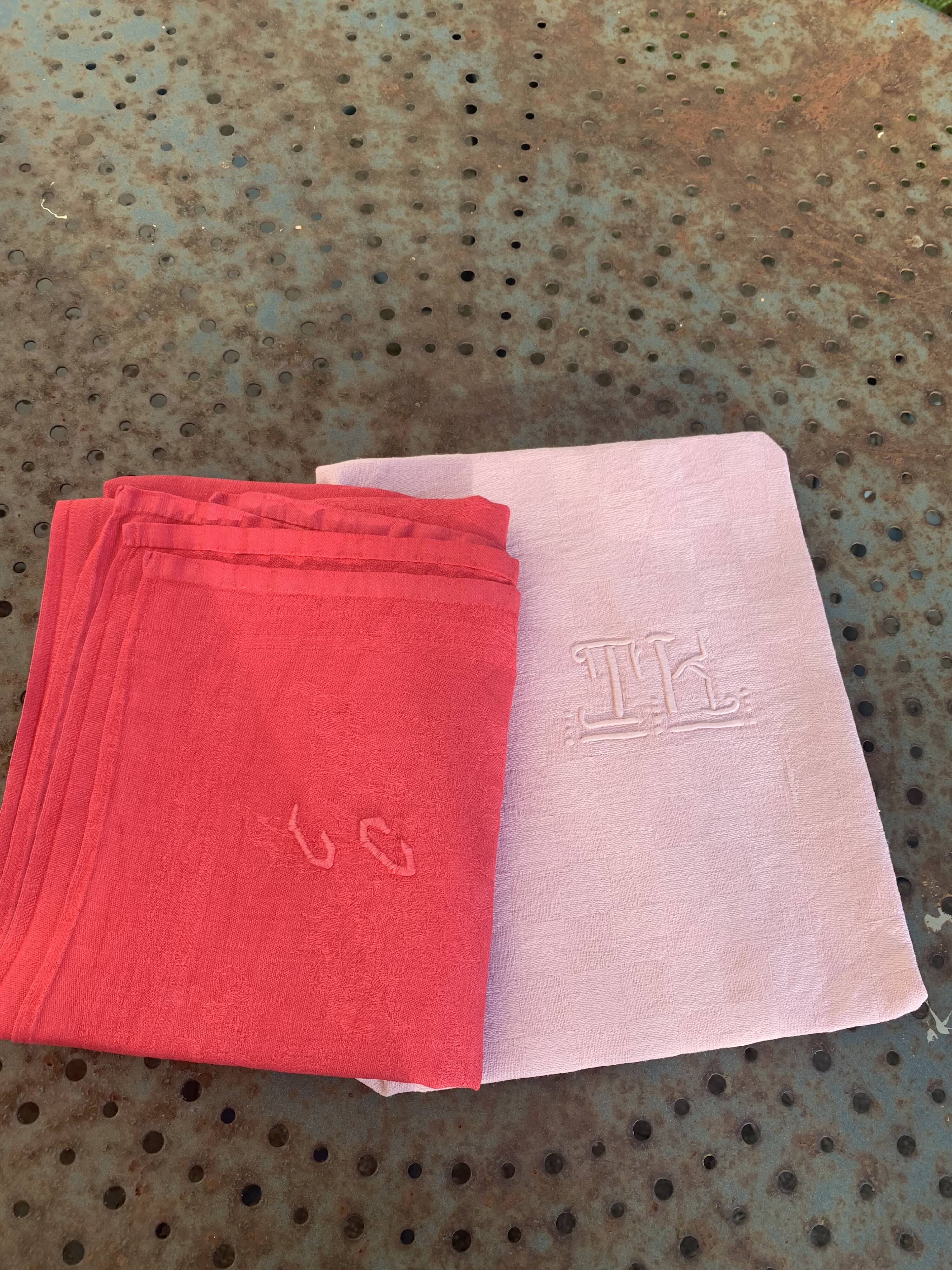 Duo set, consisting of two large pink-dyed cotton and linen towels, embroidered, TK monograms