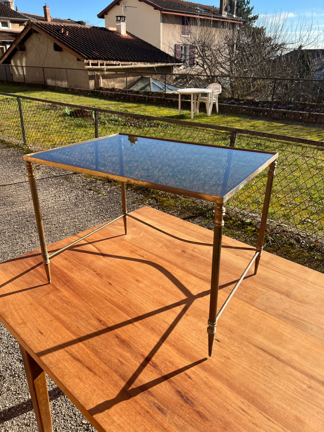 Brass side table with smoked glass.