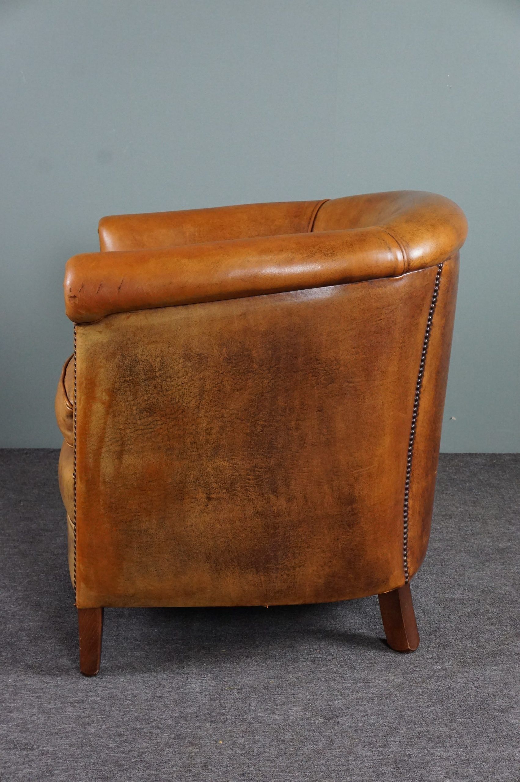 Club armchair in cognac-colored sheepskin