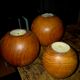 Set of 3 spherical olive wood candle holders in boho style.
