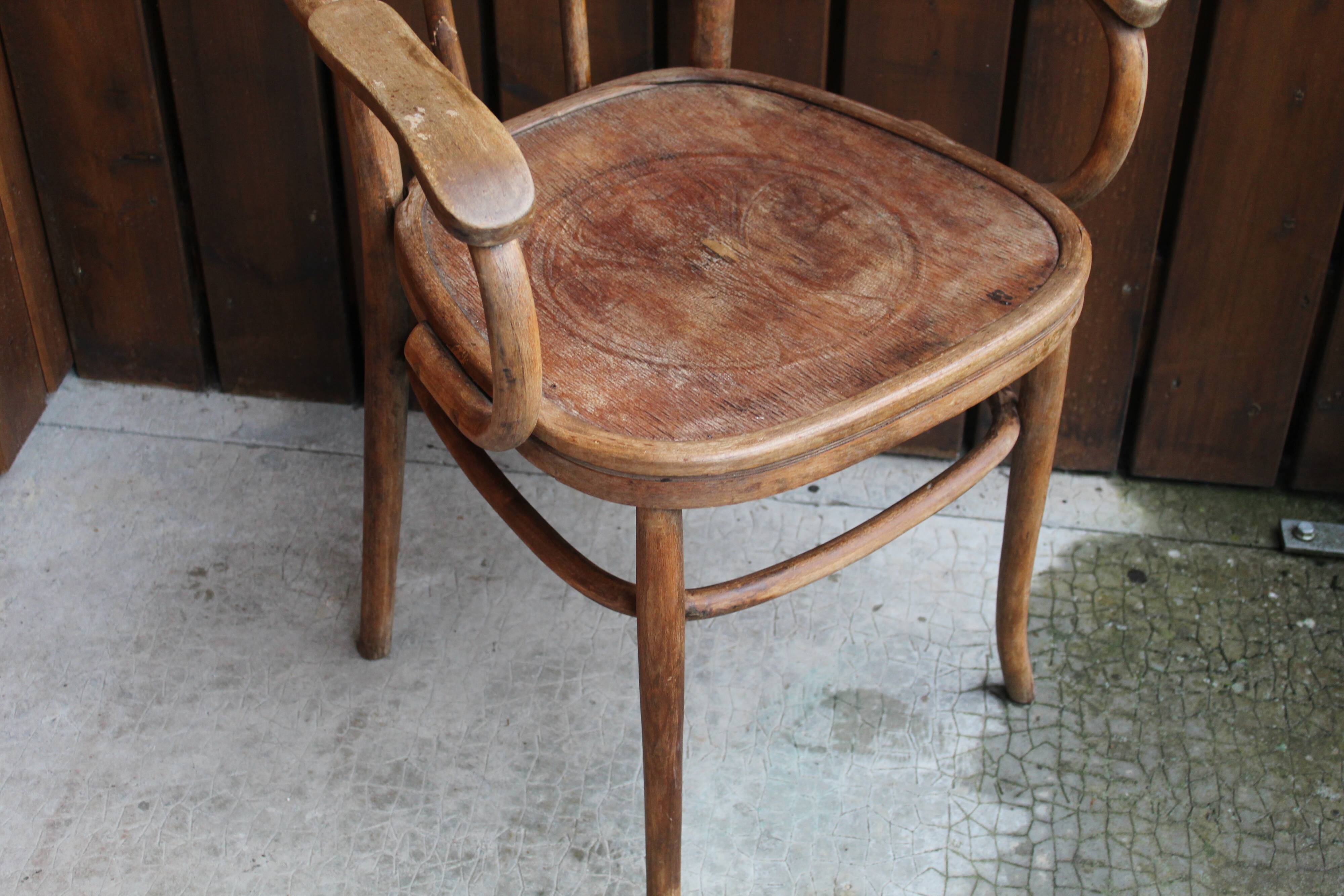 Curved wooden armchair