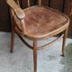 Curved wooden armchair
