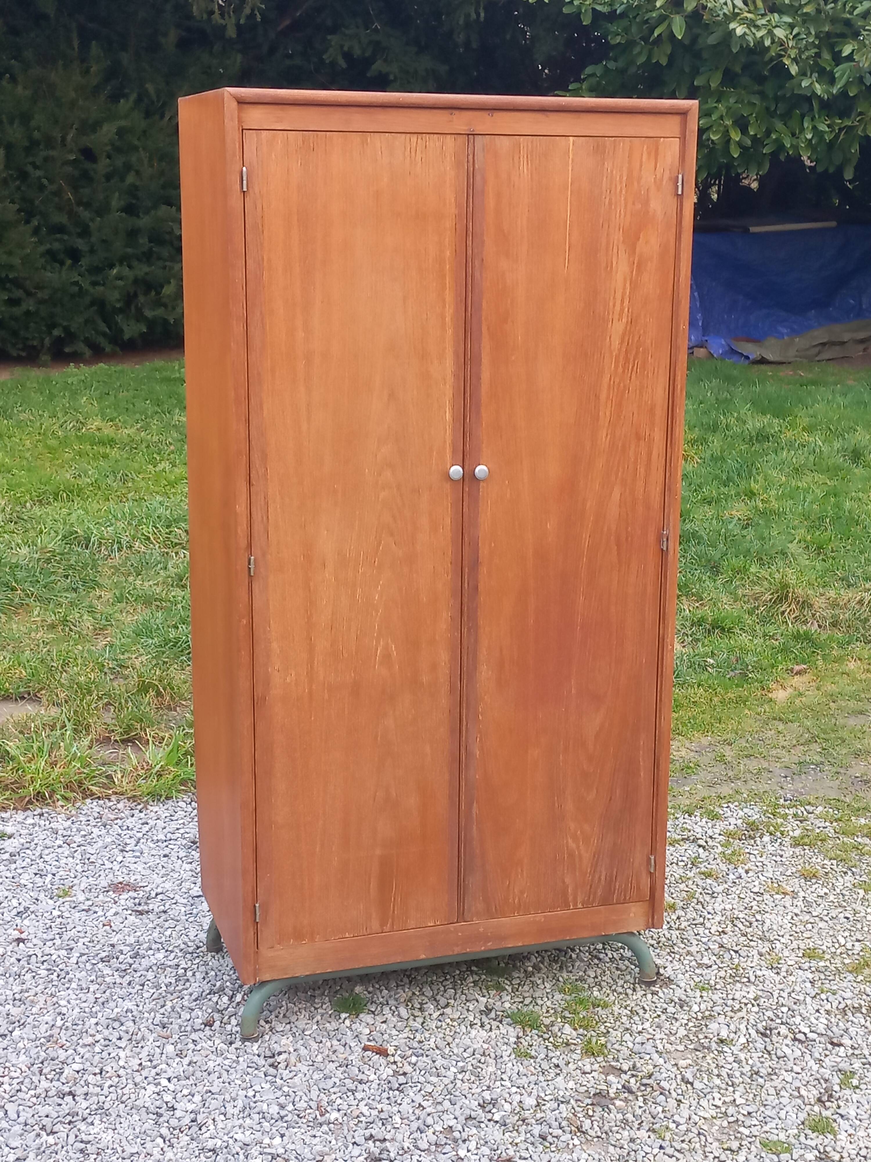Vintage oak wardrobe with metal legs from the 1950s.