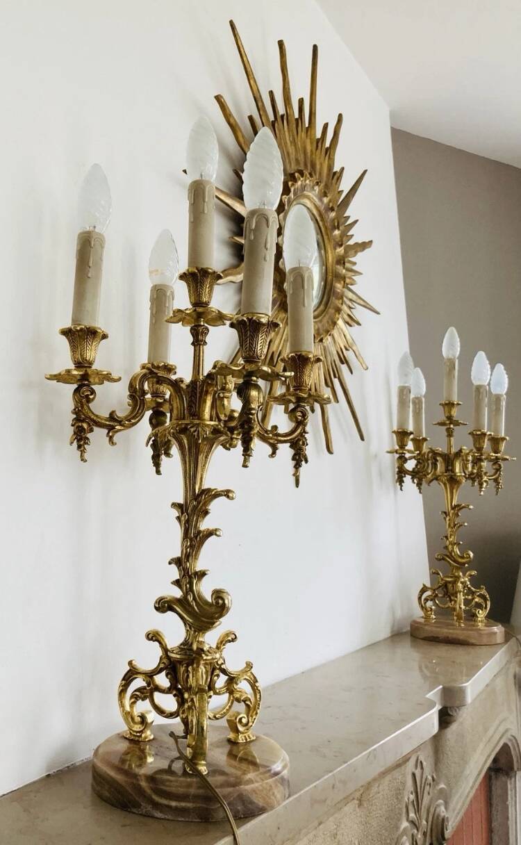 Pair of gilt bronze chandeliers, marble bases.