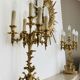 Pair of gilt bronze chandeliers, marble bases.