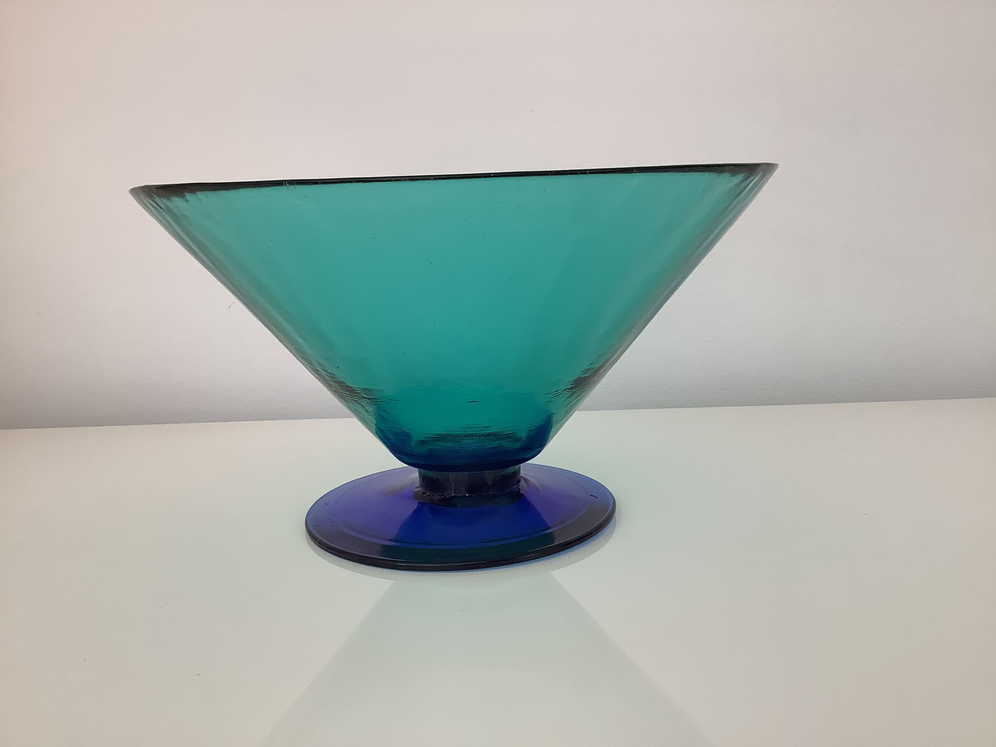 Glass fruit cup on foot, green and blue