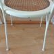 Canned chair with wooden and metal braces