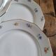 Lot de 8 assiettes en porcelaine à douze pans coupés – décor floral et