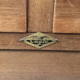 EAGLE in Paris. Wooden archive cabinet opening with two drawers and a curtain.