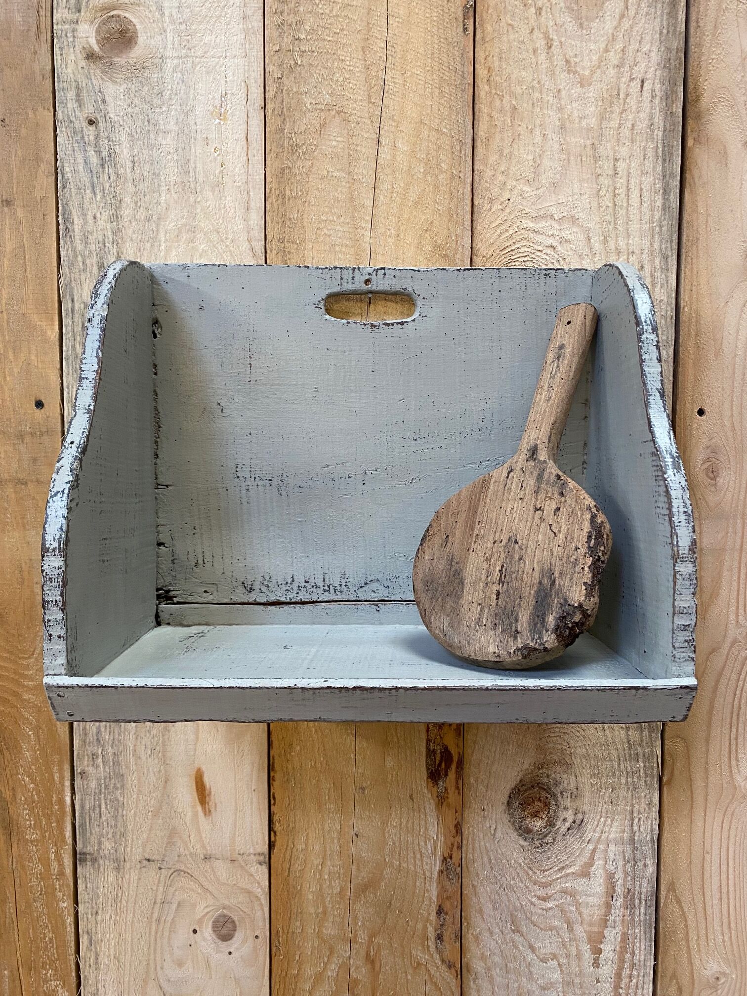 Old patinated washerwoman tray and its beater
