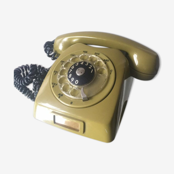 Vintage mustard green rotary telephone