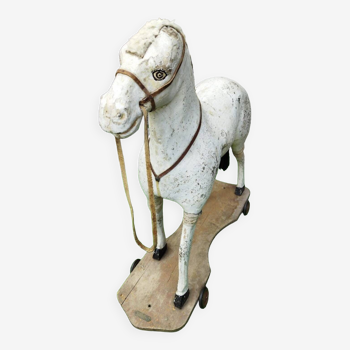 Old wooden horse, toy on wheels