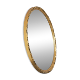 Oval mirror with gilded wood from the 1960s.