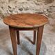 Antique round side table with oak legs and a pine top, circa 1900.