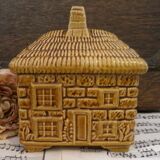 Devonway jam pot in the shape of a cottage with a thatched roof.