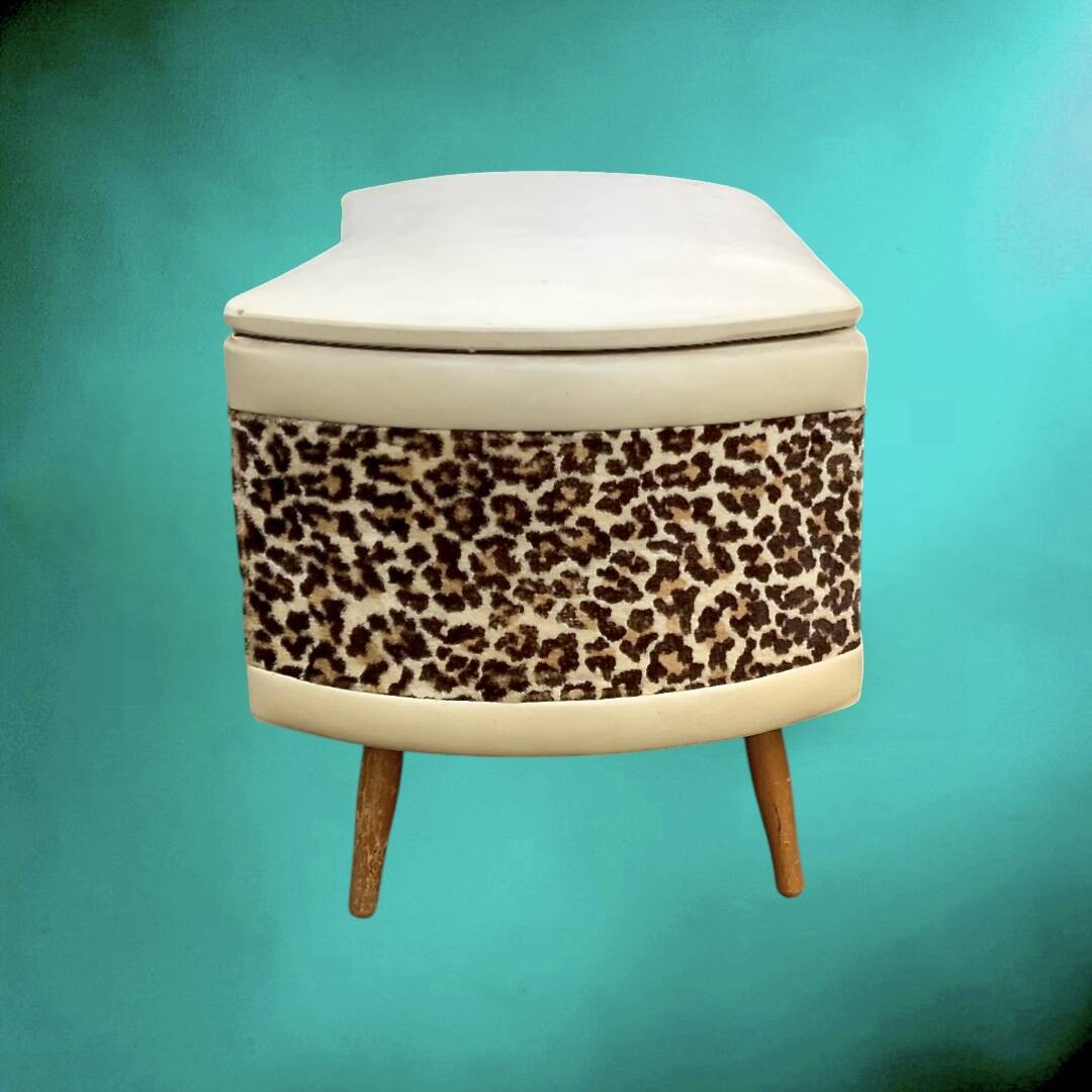 Vintage storage stool with compass legs in white faux leather and leopard velvet.