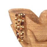 Wooden hand emptier holding a shell, 1970s