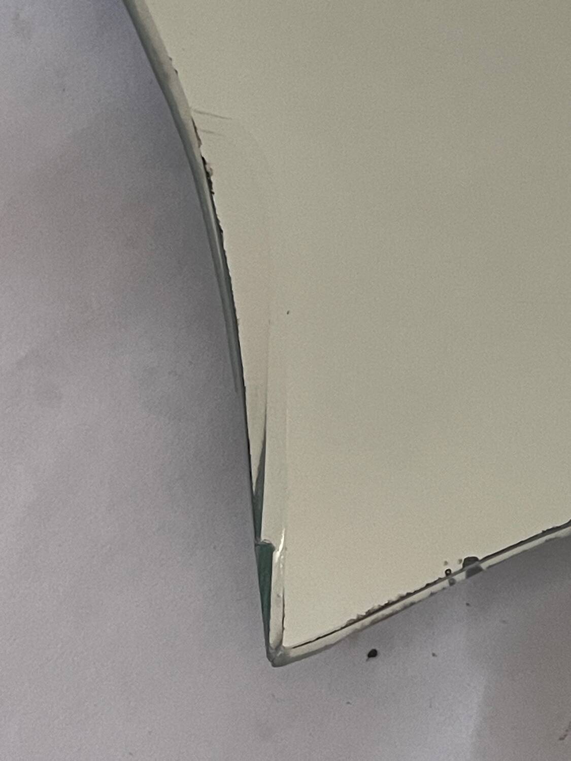 Free-form mirror signed Mathias 55x59cm