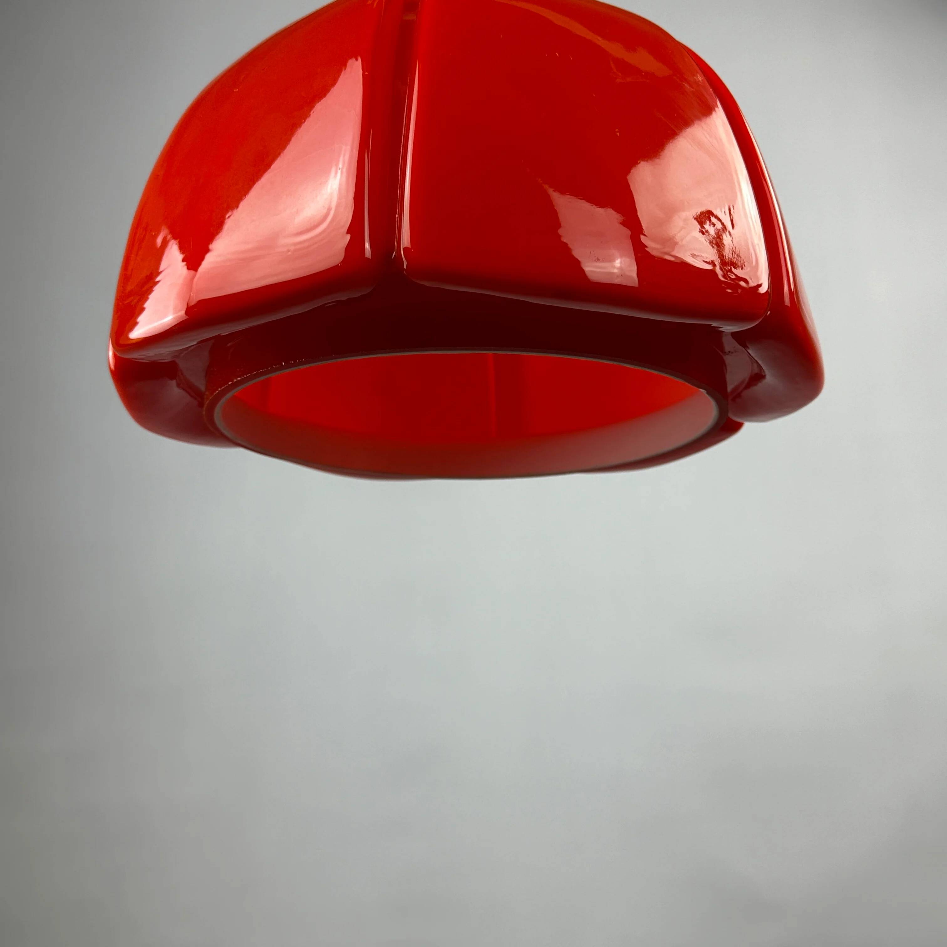 Red glass flower-shaped pendant by Glashütte Limburg.
