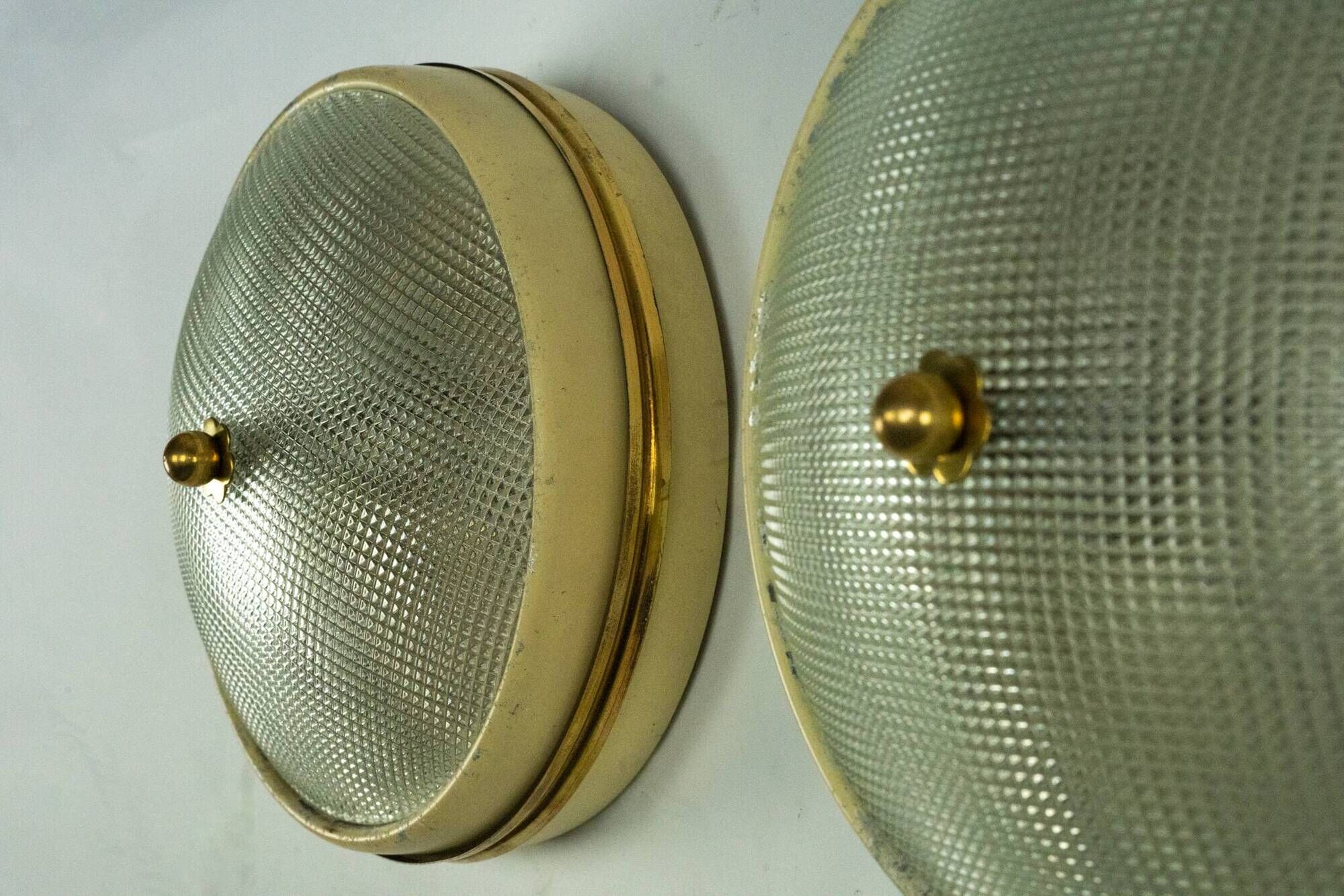 Lumi Milano, pair of wall or ceiling lamps in glass, brass and lacquer, 50s