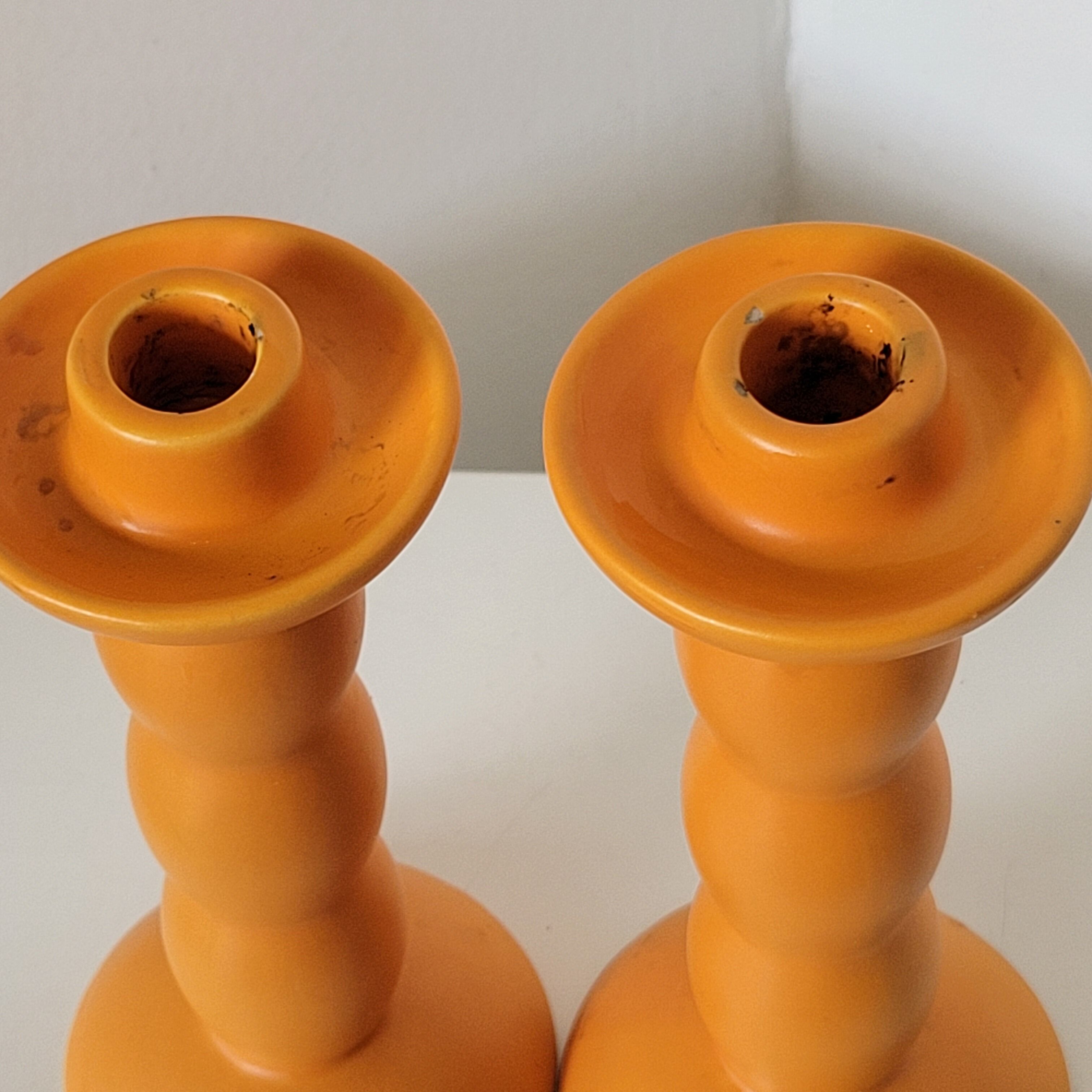 2 orange ceramic candle holders