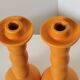 2 orange ceramic candle holders
