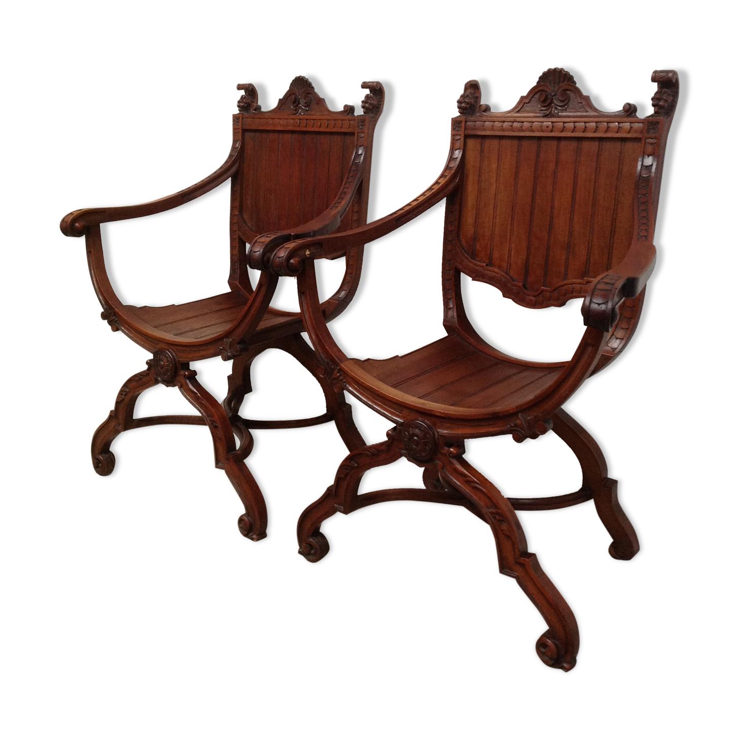 Pair of antique armchairs curules called Dagobert in carved wood