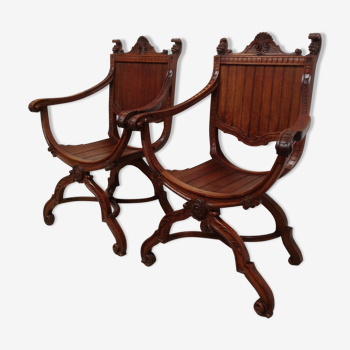 Pair of antique armchairs curules called Dagobert in carved wood