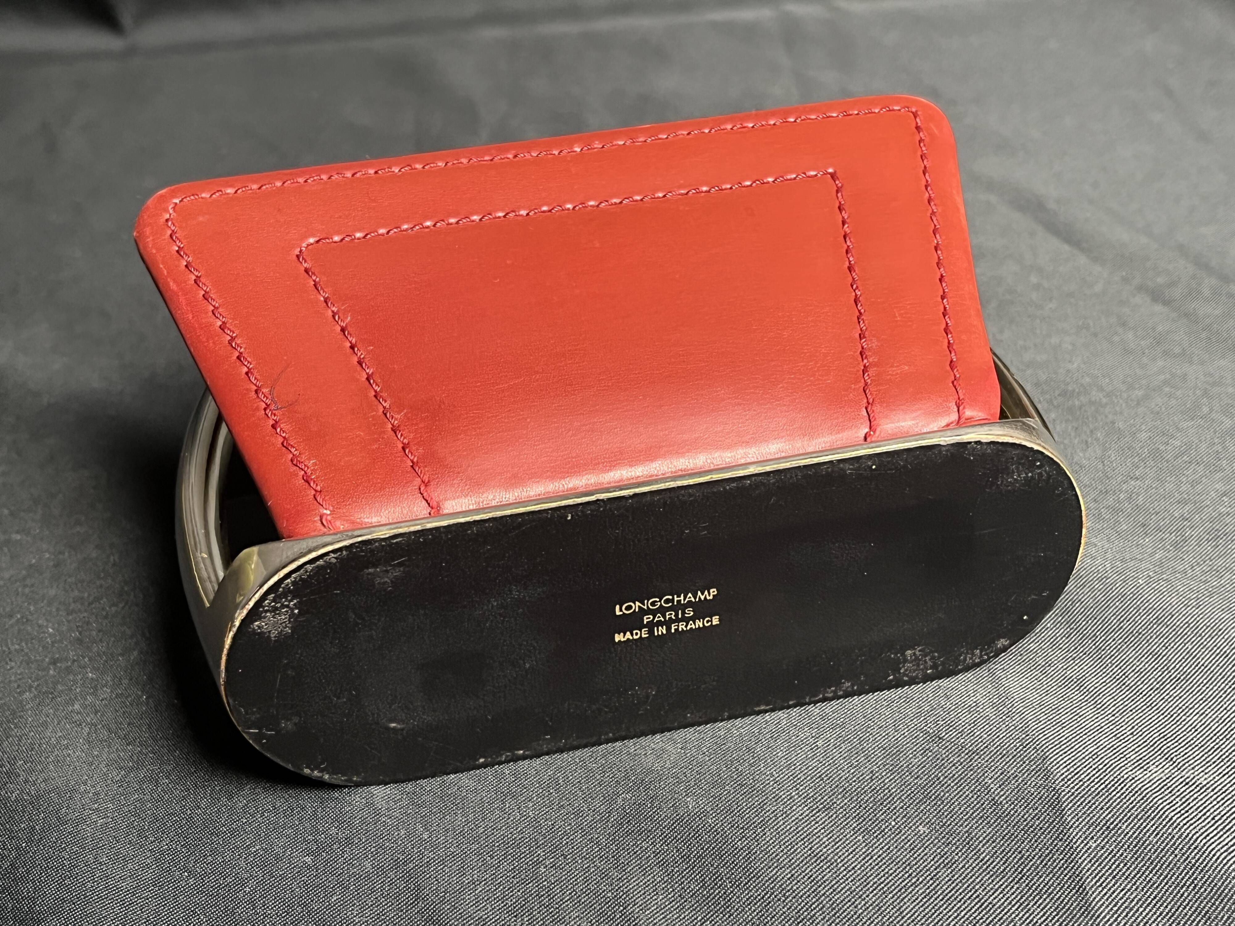 Longchamp, empty pocket document holder with leather and gold metal stirrup from around 1970.
