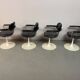 A striking set of four vintage swivel dining chairs