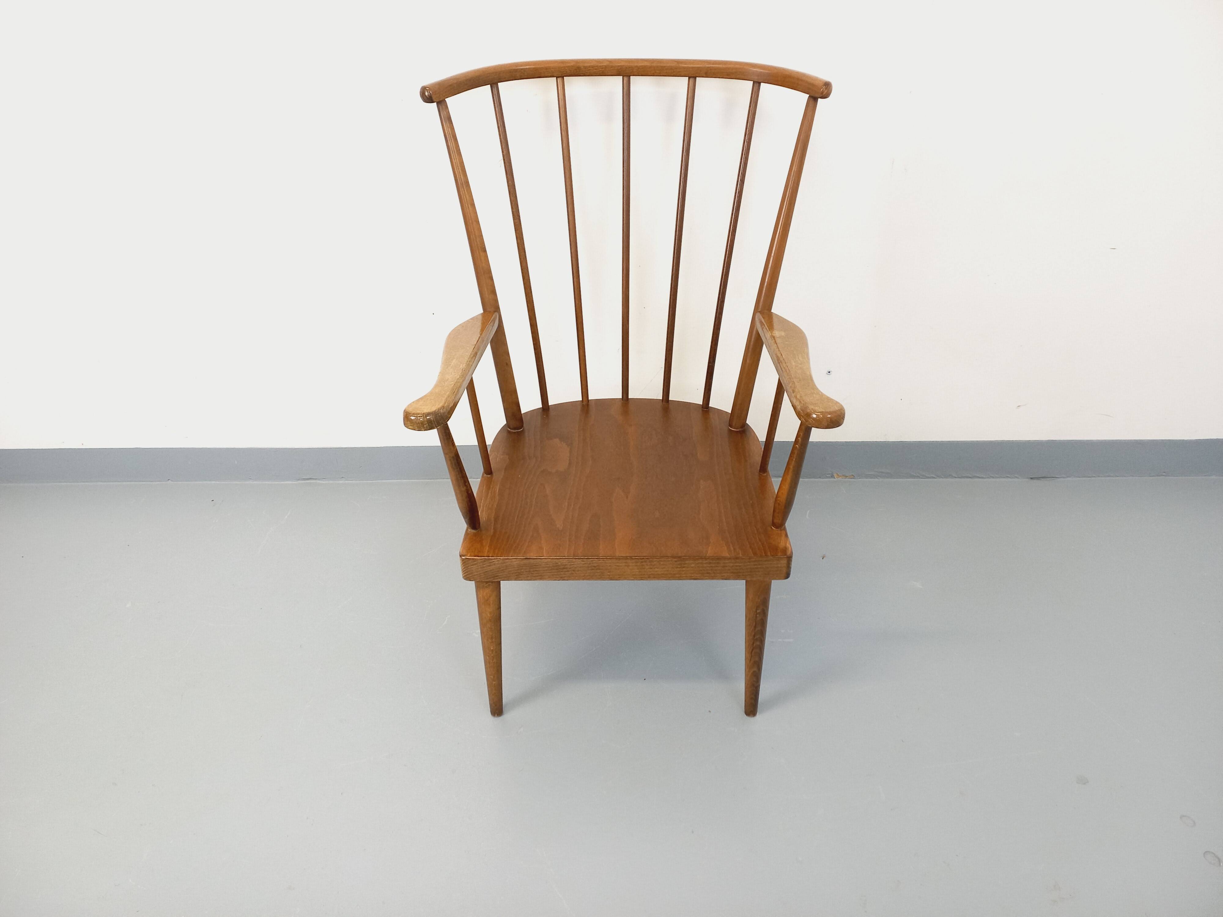Vintage wooden armchair Baumann model Éventail from the 1960s.