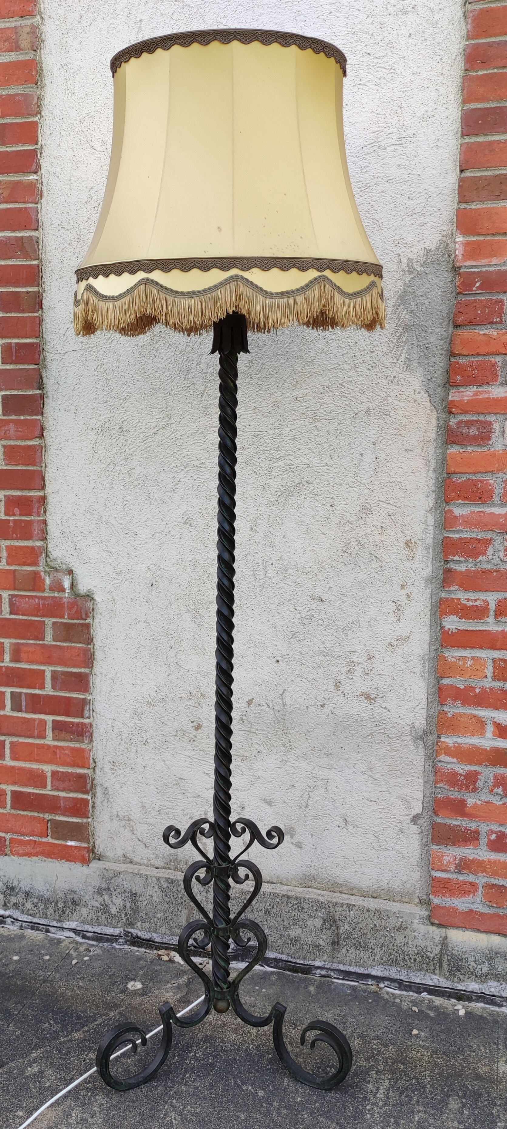 Wrought iron tripod floor lamp