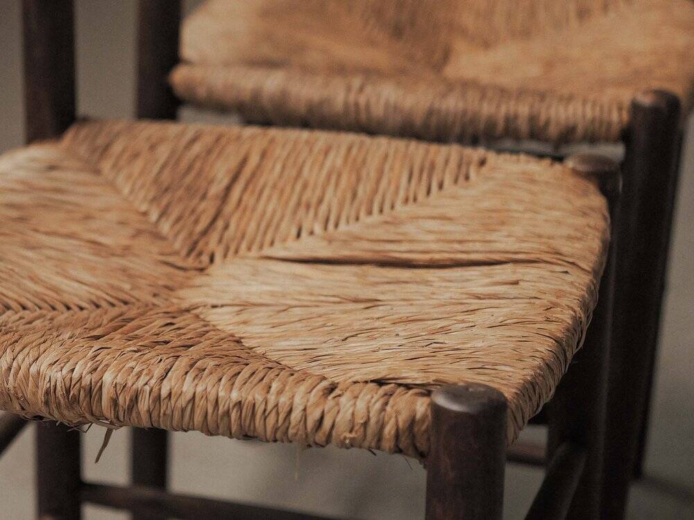 Set of four wooden and straw chairs, around 1960.