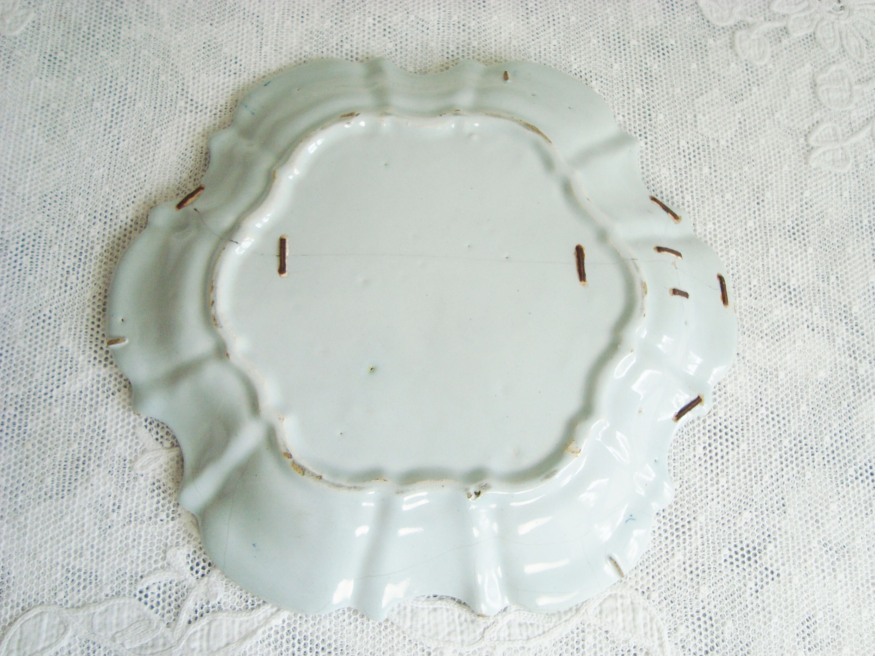 Old blue and white Delft decorative plate with Chinese motifs