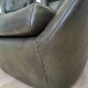 Dark green vintage leather armchair: 1970s Scandinavian style