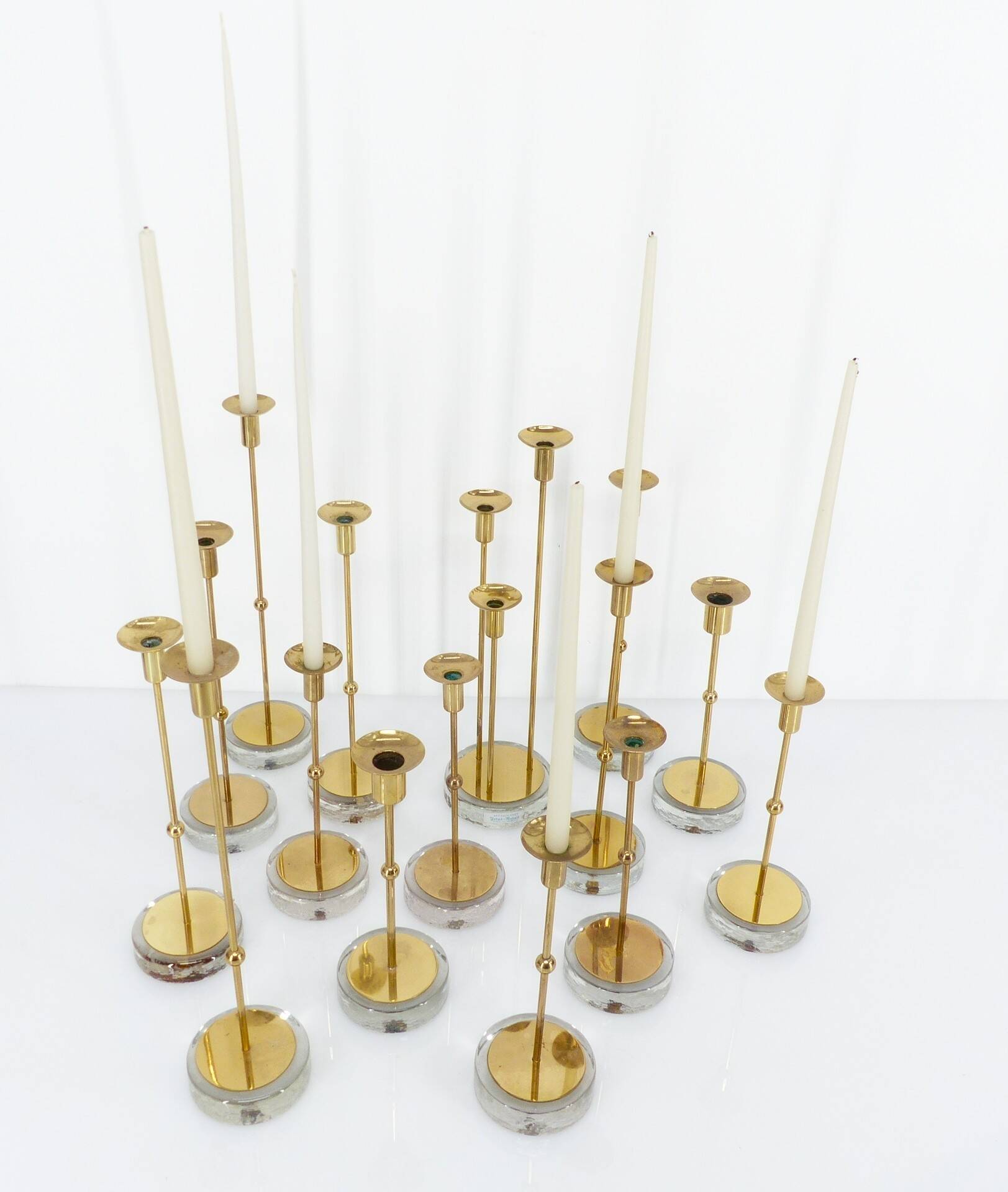 Set of 15 Scandinavian candle holders in brass and glass, Gunnar Ander, Ystad Met