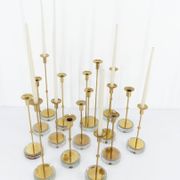 Set of 15 Scandinavian candle holders in brass and glass, Gunnar Ander, Ystad Met